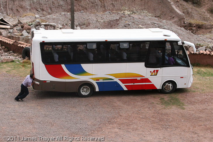 Our driver helps to push start the National Geographic Tours bus.